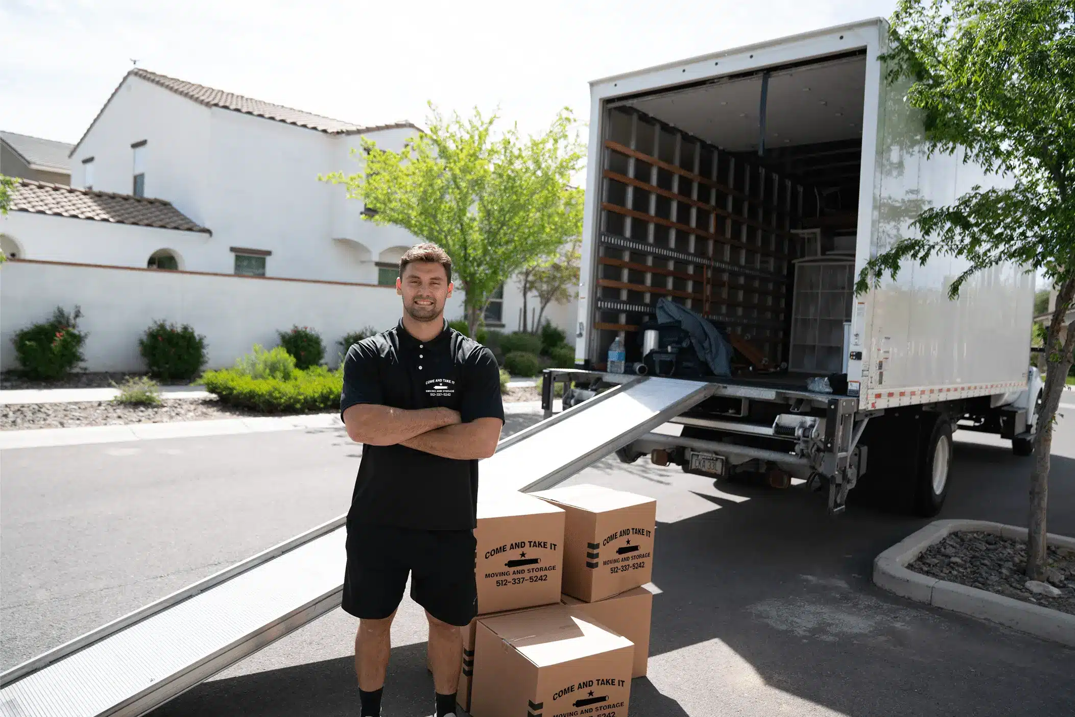 a member of Come and Take It in front of a truck